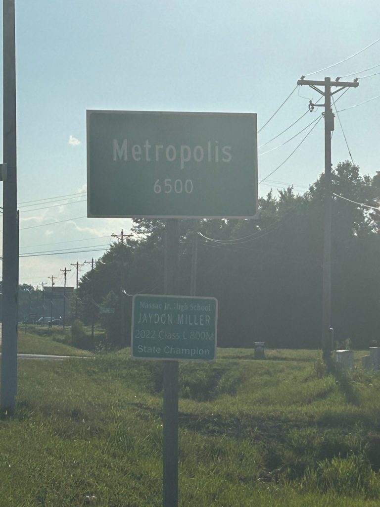 Welcome sign for Metropolis, Illinois, neighboring town to the home of Metropolis IL Real Estate